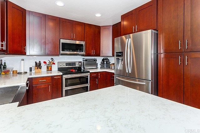 stainless steel appliances and new cabinets