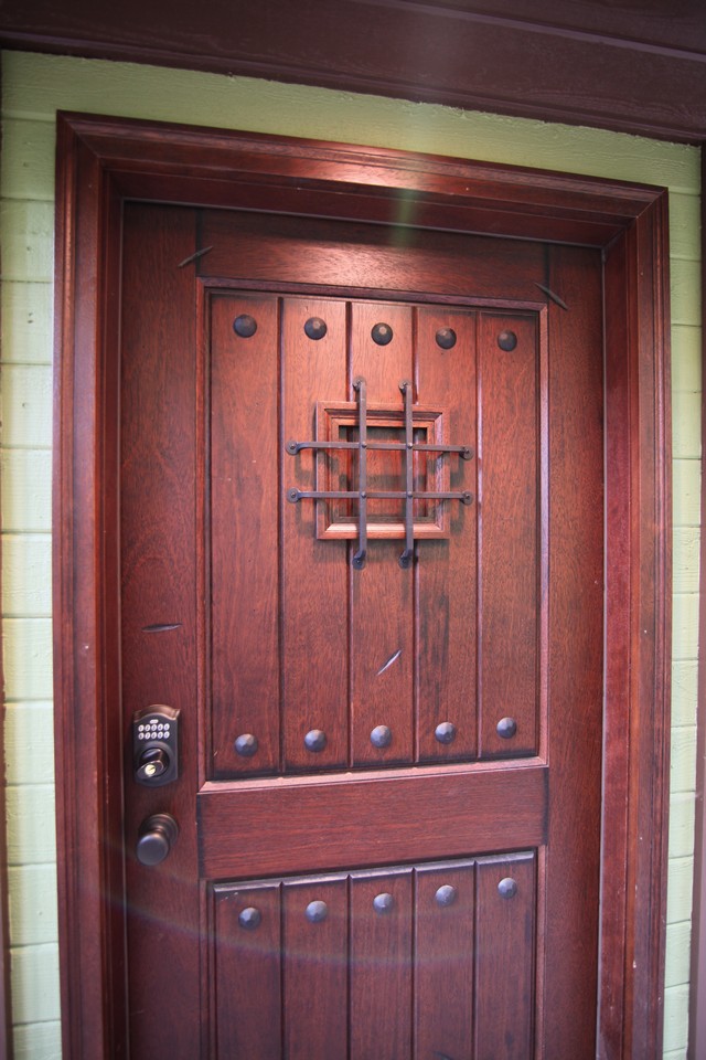 custom front door with keyless entry, clavos and speakeasy