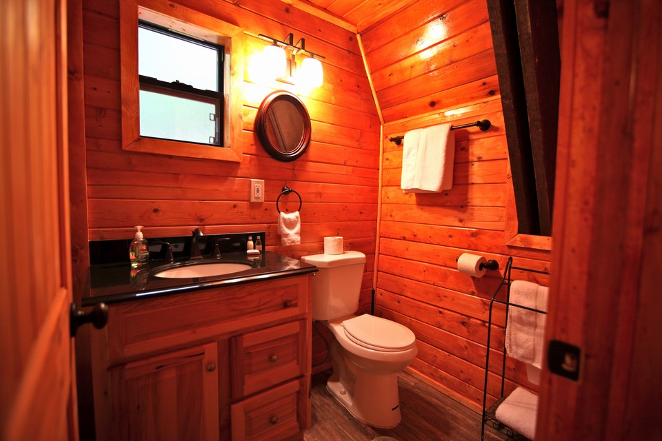 full bath with new hickory wood cabinet and black granite counter top