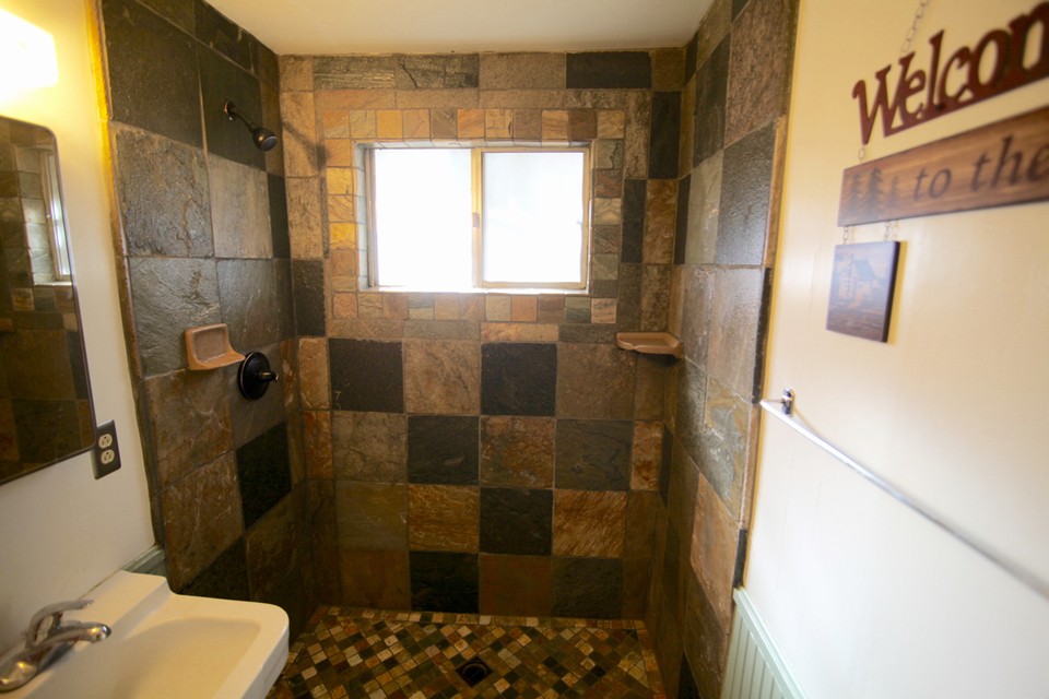 custom shower with quartz slate