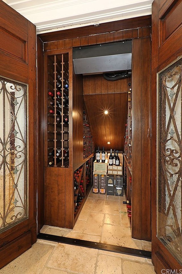 refrigerated wine storage with antique french doors