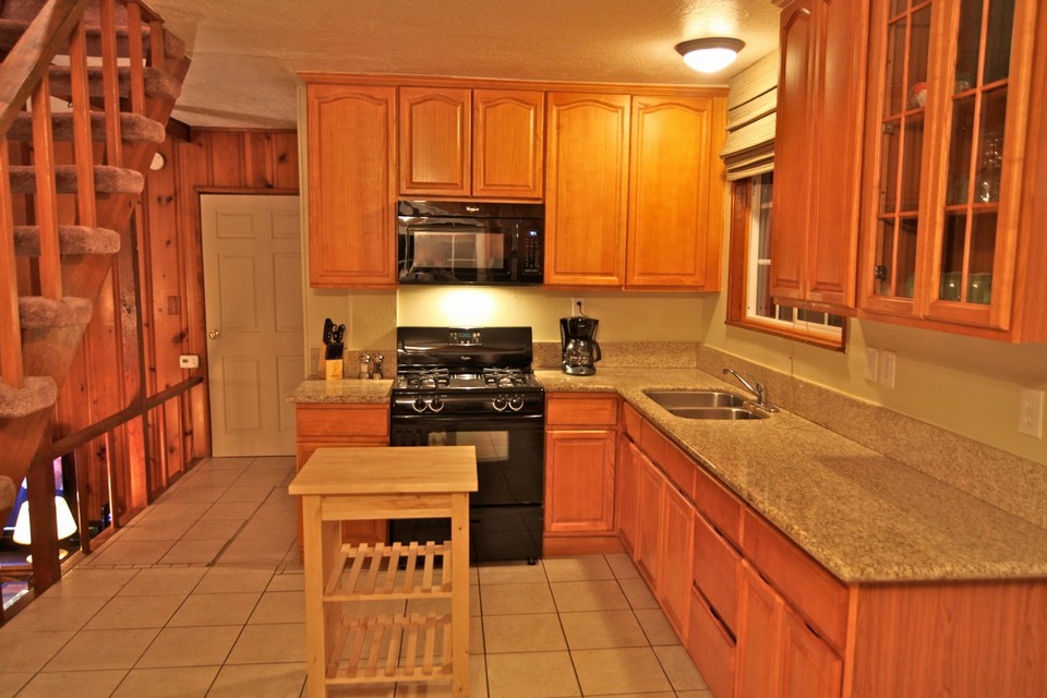 remodeled kitchen with granite counters