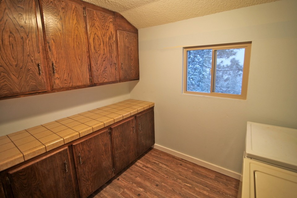large laundry room and lots of cabinet storage