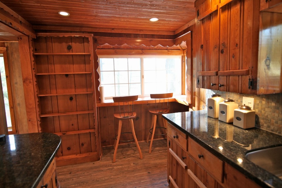 facing front of kitchen area - original cabinets with new countertops