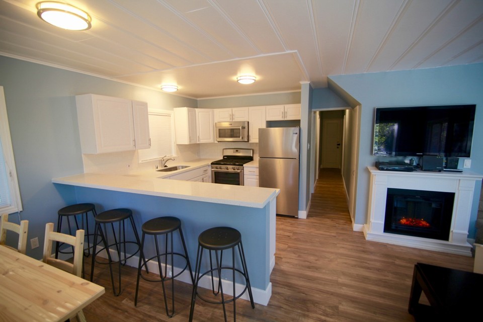 view from front door toward kitchen and new white quartz counters